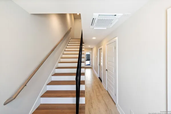 a view of entryway with wooden floor