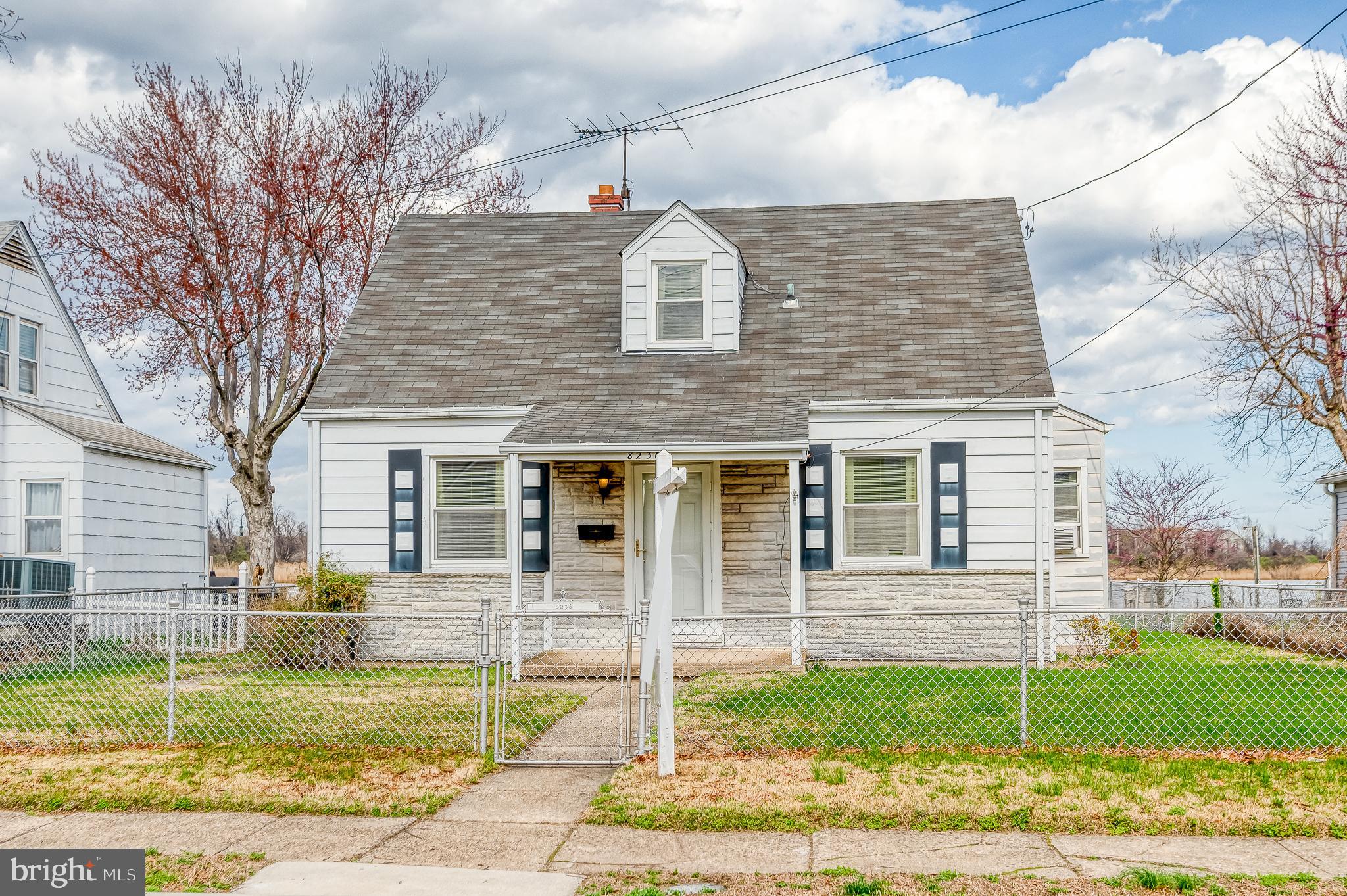 8236 Northview Road Baltimore, MD 21222 - Photo 54 of 56 a front view of a house with a yard