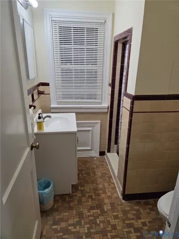 a bathroom with sink toilet and a bathtub