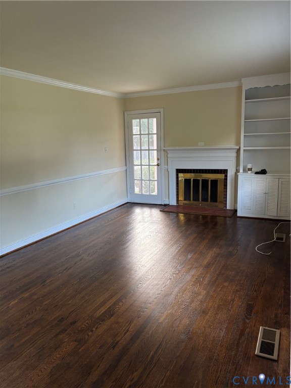 5813 Fitzhugh Avenue Richmond, VA 23226 - Photo 17 of 20 an empty room with wooden floor fireplace and windows