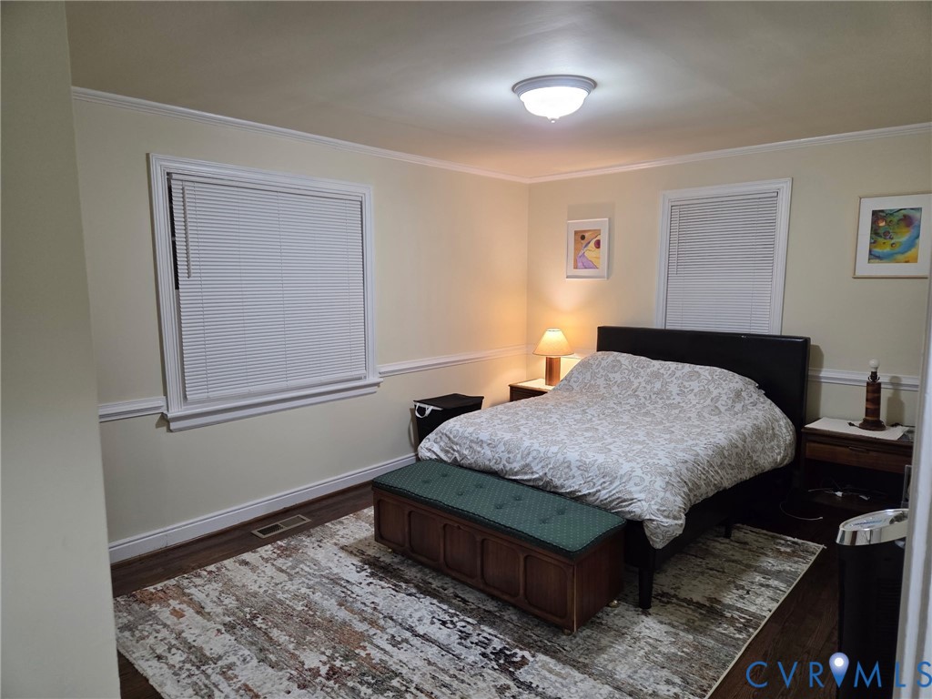 5813 Fitzhugh Avenue Richmond, VA 23226 - Photo 7 of 20 a bedroom with a bed rug and wooden floor