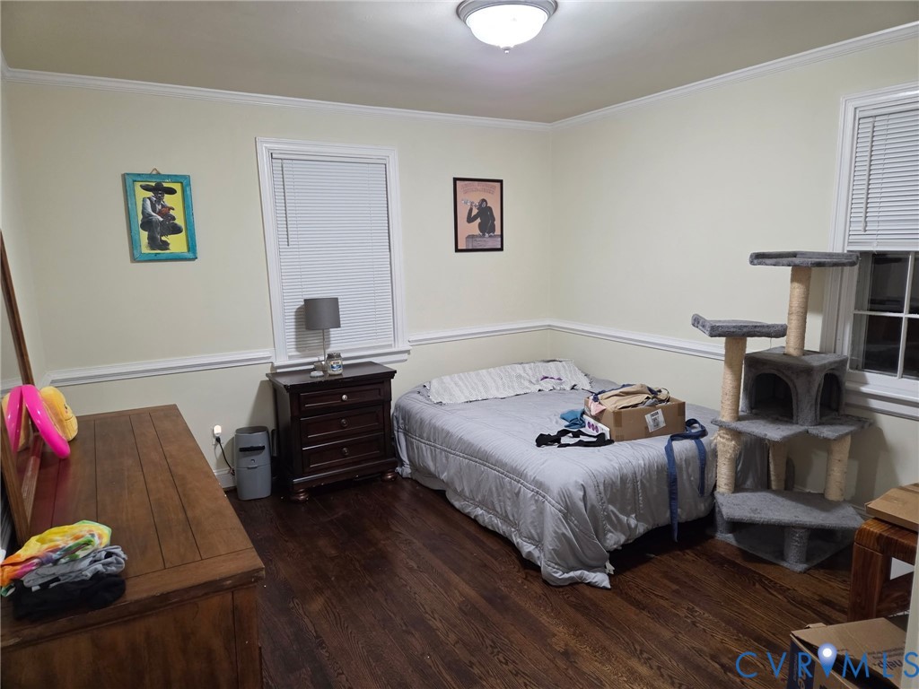 5813 Fitzhugh Avenue Richmond, VA 23226 - Photo 9 of 20 a bedroom with furniture and a wooden floor