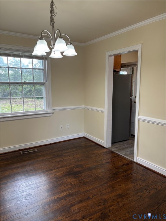 5813 Fitzhugh Avenue Richmond, VA 23226 - Photo 10 of 20 an empty room with wooden floor chandelier and windows