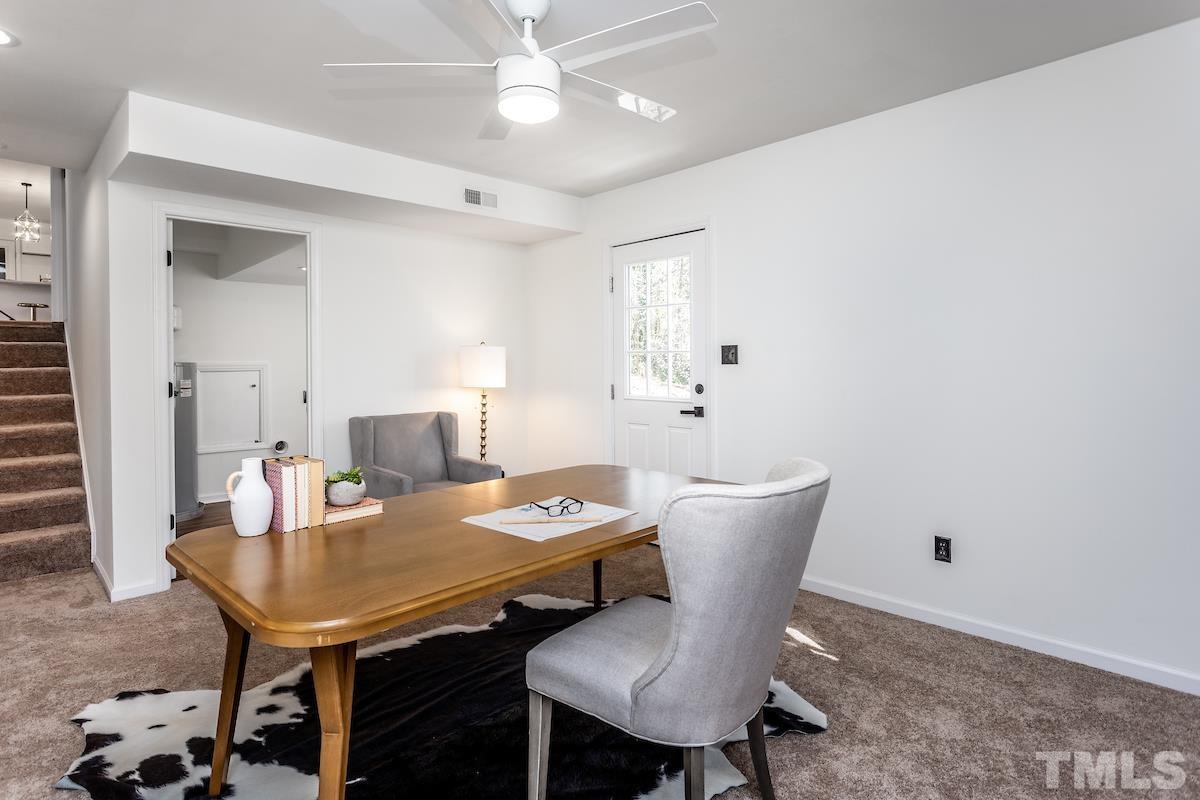313 Lord Ashley Road Raleigh, NC 27610 - Photo 11 of 32 a view of a dining room with a table and chairs