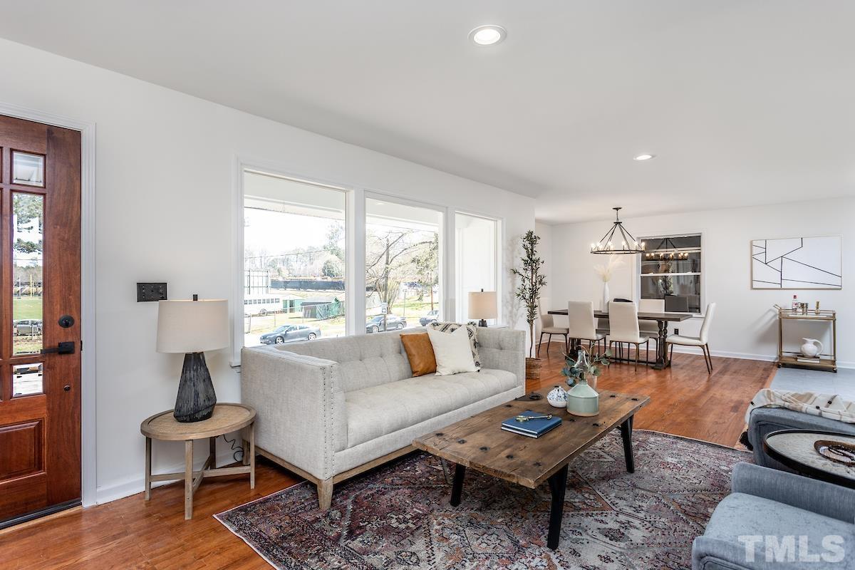 313 Lord Ashley Road Raleigh, NC 27610 - Photo 15 of 32 a living room with furniture and a large window