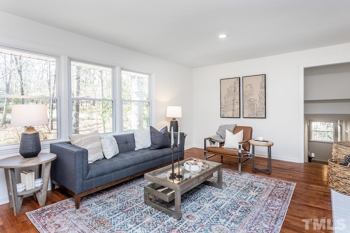 313 Lord Ashley Road Raleigh, NC 27610 - Photo 16 of 32 a living room with furniture and a rug