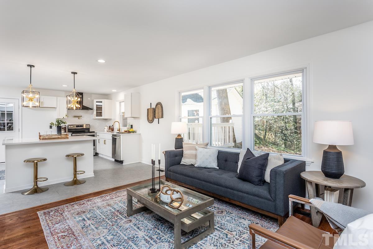 313 Lord Ashley Road Raleigh, NC 27610 - Photo 17 of 32 a living room with furniture and a wooden floor