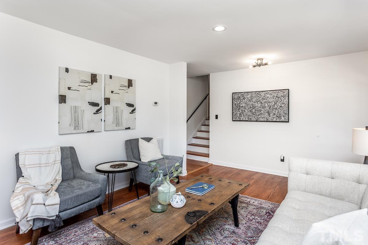 313 Lord Ashley Road Raleigh, NC 27610 - Photo 18 of 32 a living room with furniture and wooden floor