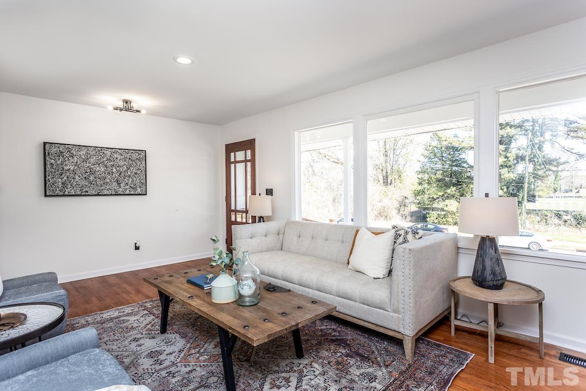 313 Lord Ashley Road Raleigh, NC 27610 - Photo 19 of 32 a living room with furniture and a large window