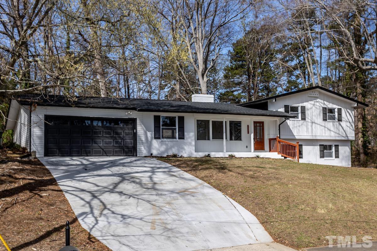 313 Lord Ashley Road Raleigh, NC 27610 - Photo 2 of 32 a front view of a house with a yard