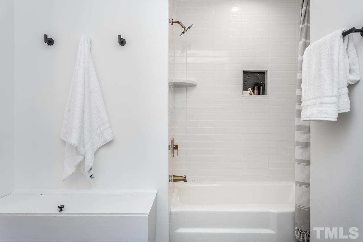 313 Lord Ashley Road Raleigh, NC 27610 - Photo 23 of 32 a bathroom with a bathtub and shower