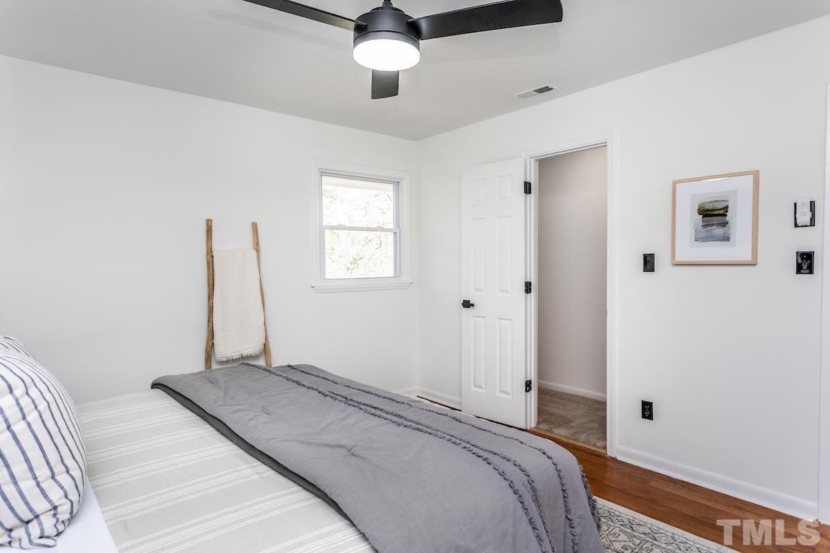 313 Lord Ashley Road Raleigh, NC 27610 - Photo 29 of 32 a bedroom with a bed and a window