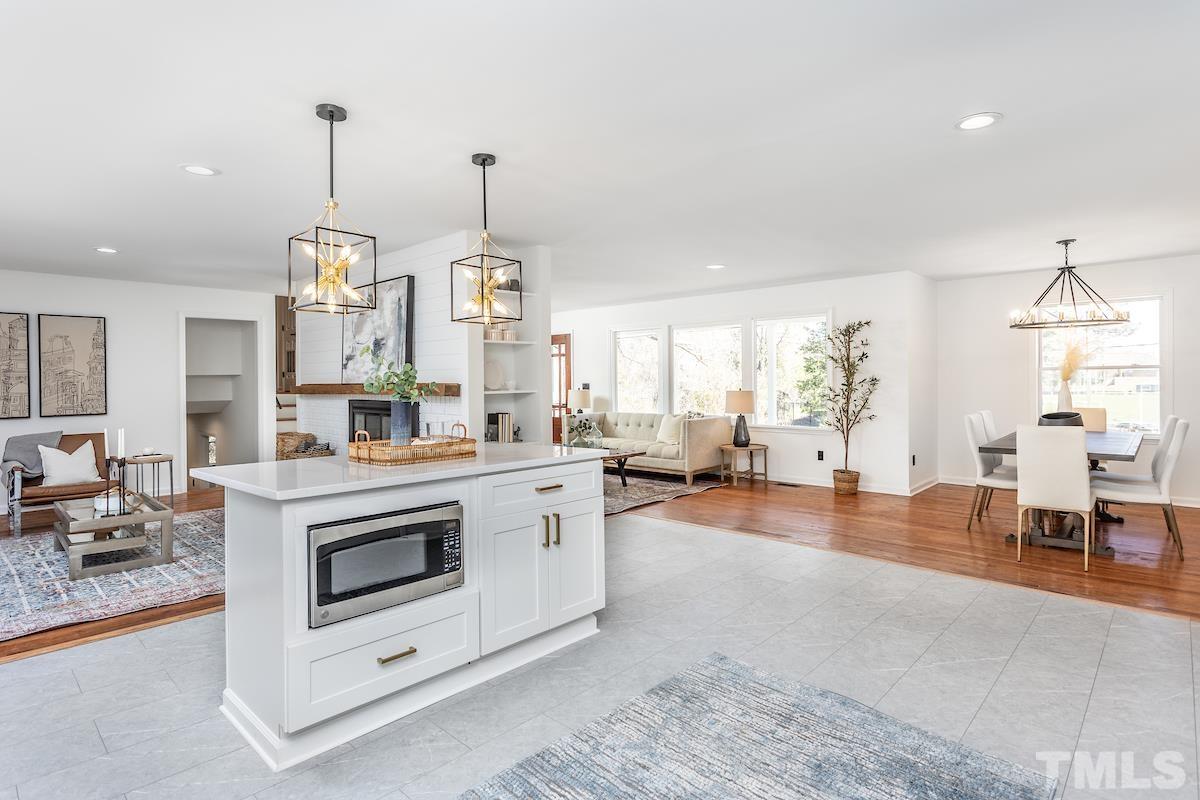 313 Lord Ashley Road Raleigh, NC 27610 - Photo 9 of 32 a view of living room with granite countertop furniture and a fireplace