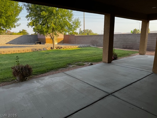 3744 River Heights Lane Logandale, NV 89021 - Photo 12 of 17 A spacious covered patio overlooks a private, well-maintained yard, perfect for outdoor enjoyment.