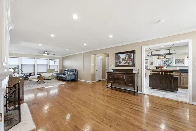 a view of a living room kitchen and a wooden floor