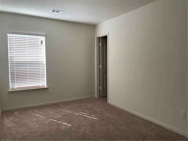 a bathroom with a granite countertop bathtub toilet and sink