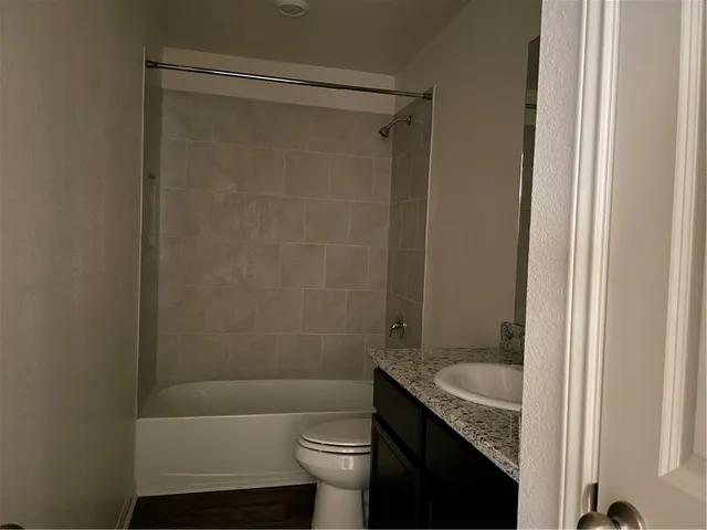 a view of a ceiling fan and a window
