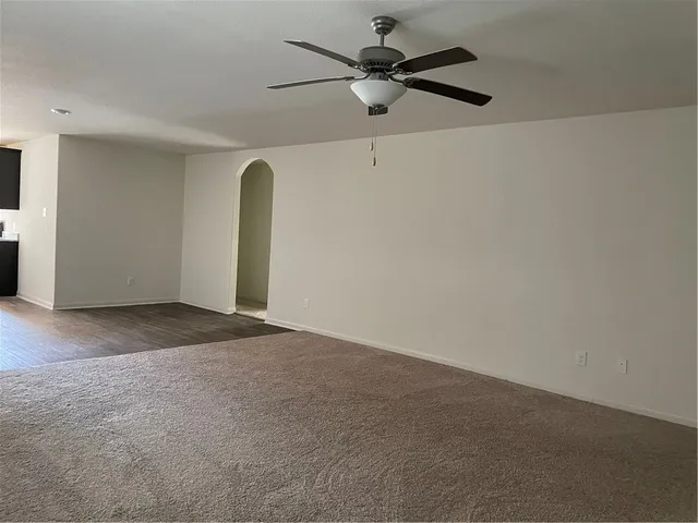 a view of an empty room with windows