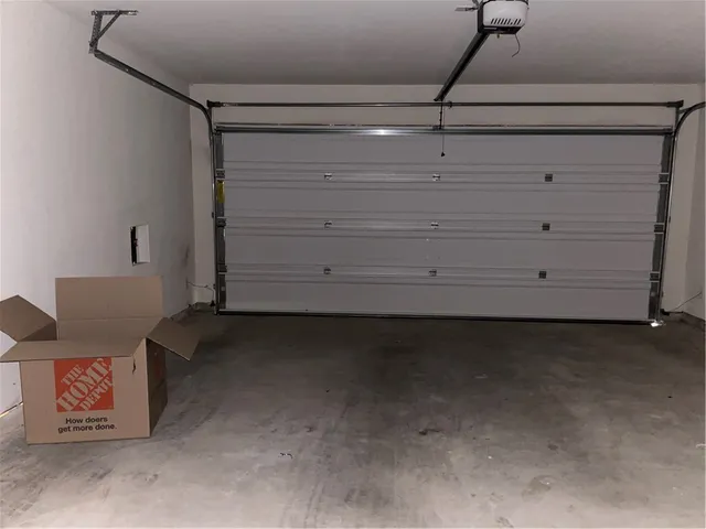 a view of a hallway with a kitchen