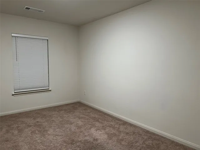 a view of a small space with wooden floor and a sink