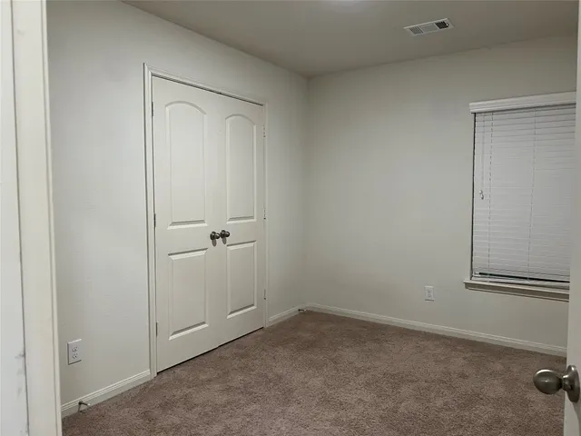 an empty room with a bench