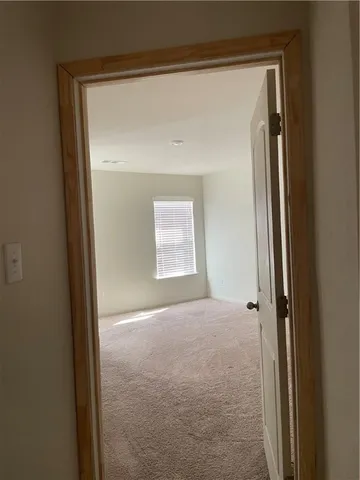a view of a bathroom from a hallway