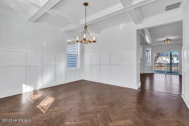 a view of a livingroom with a hardwood floor fireplace and a window