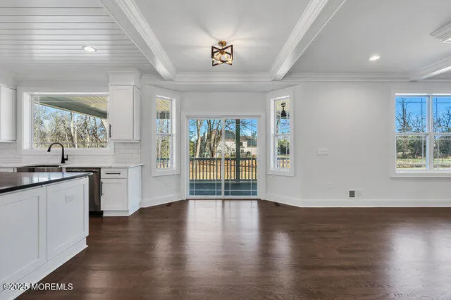 a bathroom with a toilet sink vanity and mirror
