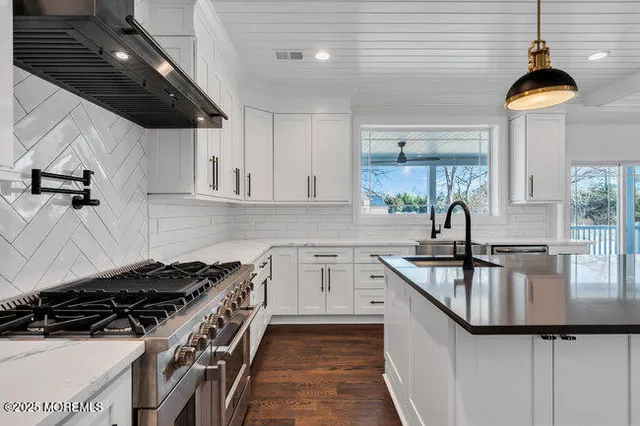 a bathroom with a double vanity sink and a mirror