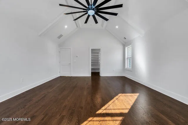 a bathroom with a shower sink and mirror