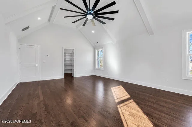 a en suite bathroom with a granite countertop sink and a mirror