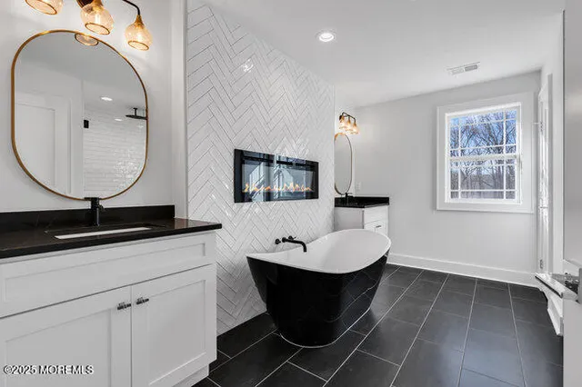 a bathroom with a toilet a sink and a mirror