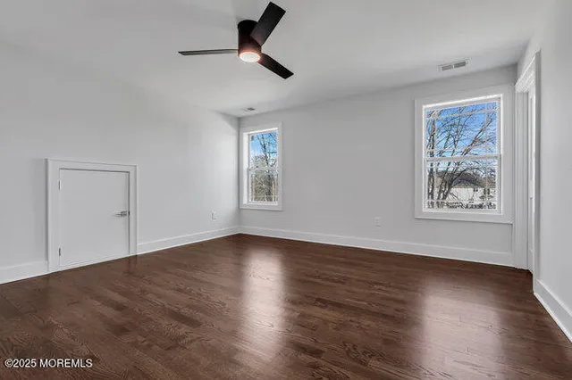 a front view of a house with a yard table and chairs