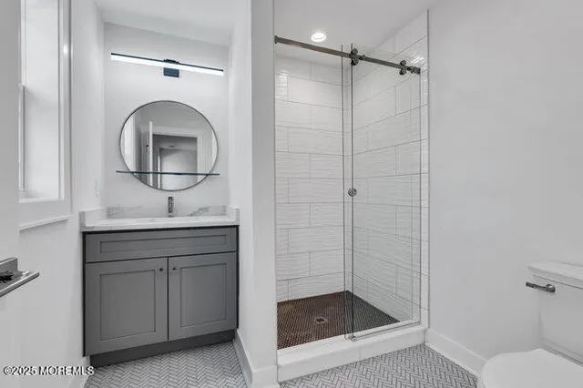 an aerial view of a house with a yard and lake view