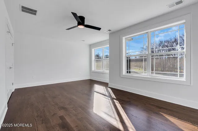 a picture of a room with a white wall and a picture of a next picture