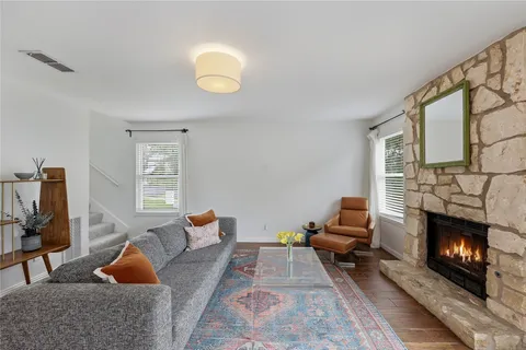 a bedroom with furniture and a fireplace