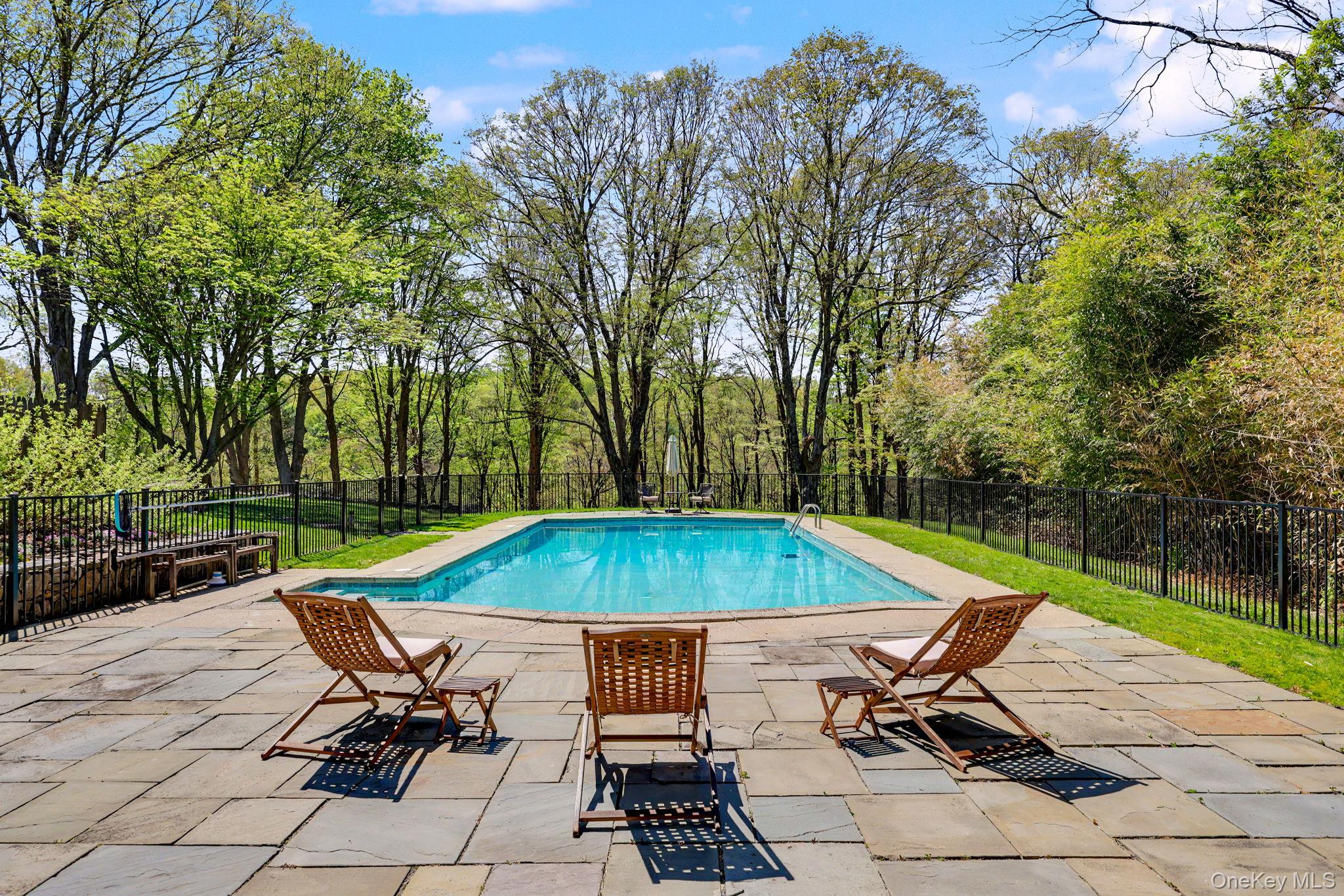 233 Long Ridge Road Bedford, NY 10506 - Photo 36 of 50 a table and chairs in the patio