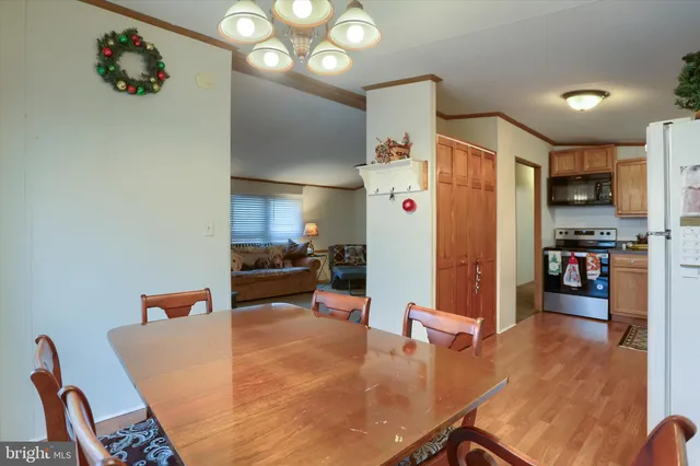 a room with furniture and a kitchen view