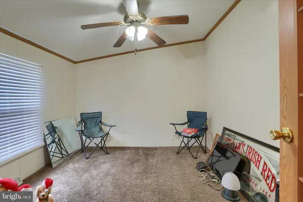 a room with furniture and white walls