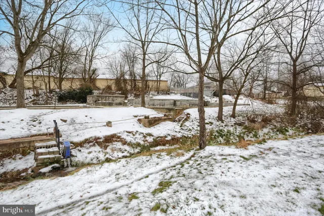 a view of a yard covered in snow