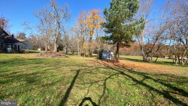 a backyard of a house with barbeque oven