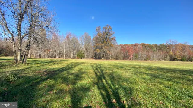 a view of a house with yard and a garden