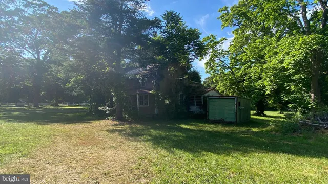 a backyard of a house with lots of green space