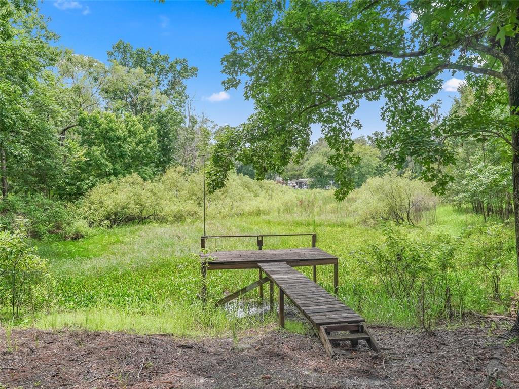 8970 Cr 646 Bushnell Bushnell, FL 33513 - Photo 29 of 39 a view of a bench in a garden