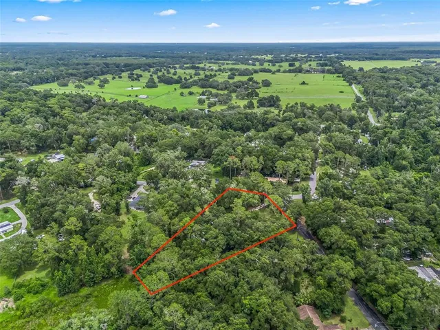 a view of a green field in the middle of a field