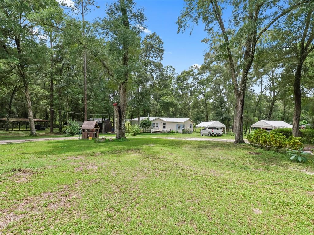 8970 Cr 646 Bushnell Bushnell, FL 33513 - Photo 38 of 39 a garden view with a seating space