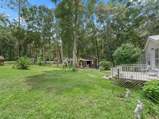 a view of a chair and table in the garden