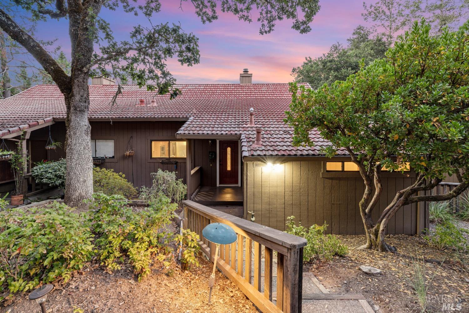 a front view of a house with garden