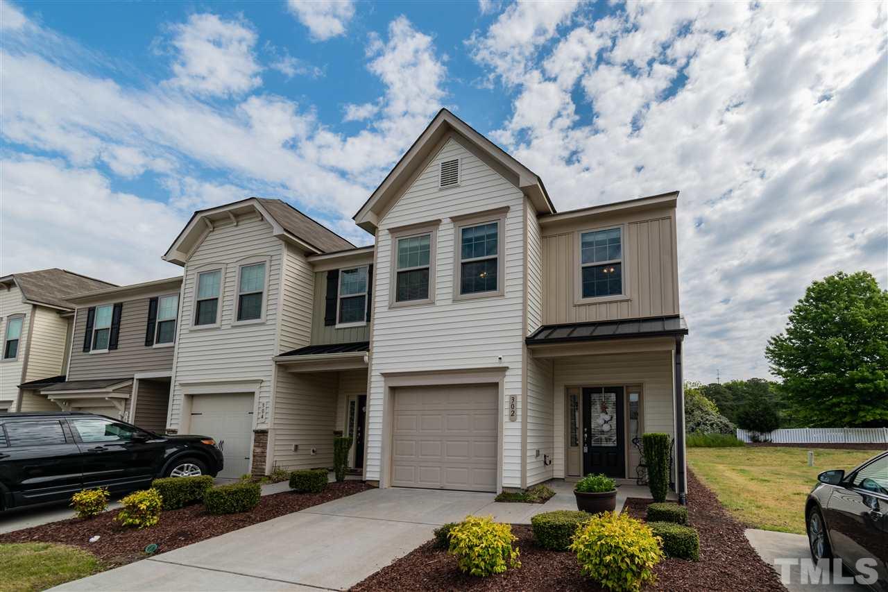 302 Leighann Ridge Lane Rolesville, NC 27571 - Photo 2 of 21 a front view of a house with garden