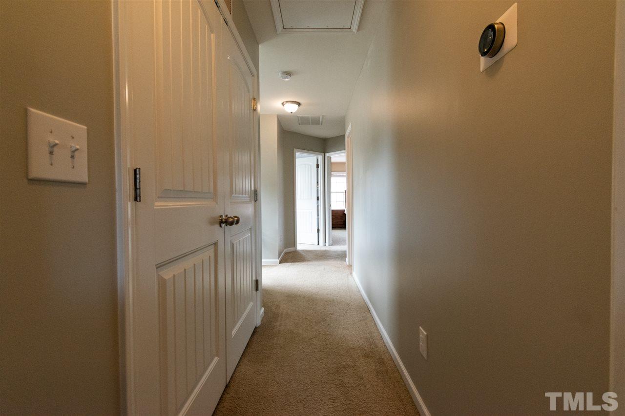 302 Leighann Ridge Lane Rolesville, NC 27571 - Photo 12 of 21 a view of a hallway with wooden floor